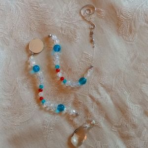 Handmade crystal Suncatcher. Orange, turquoise and clear crystals, 21" long.